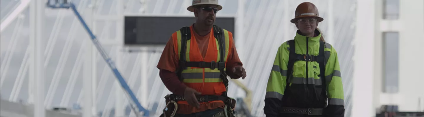 two men in hard hats on construction site