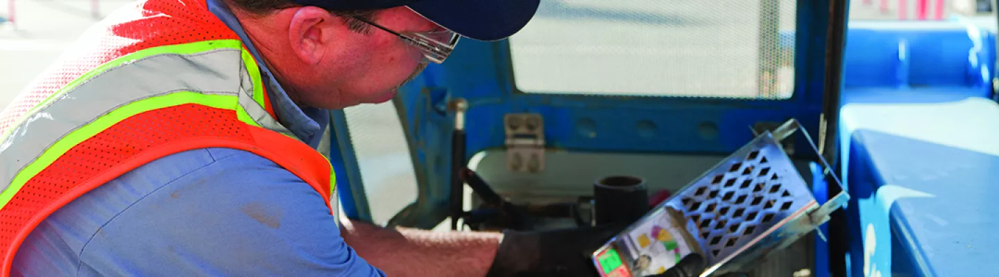 man with gloves near equipment