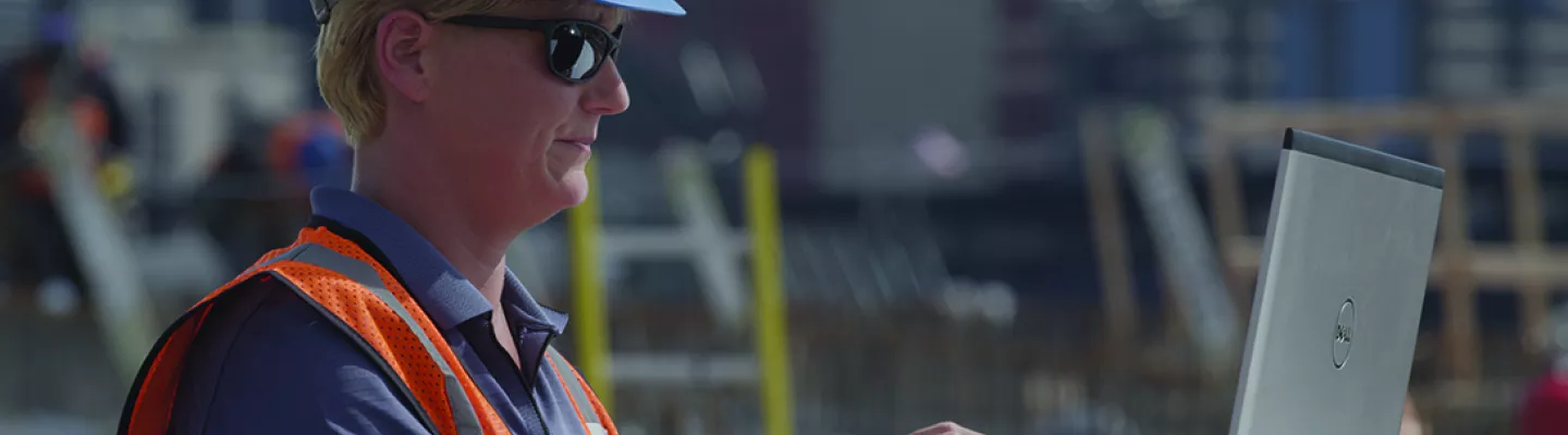 woman on jobsite with laptop
