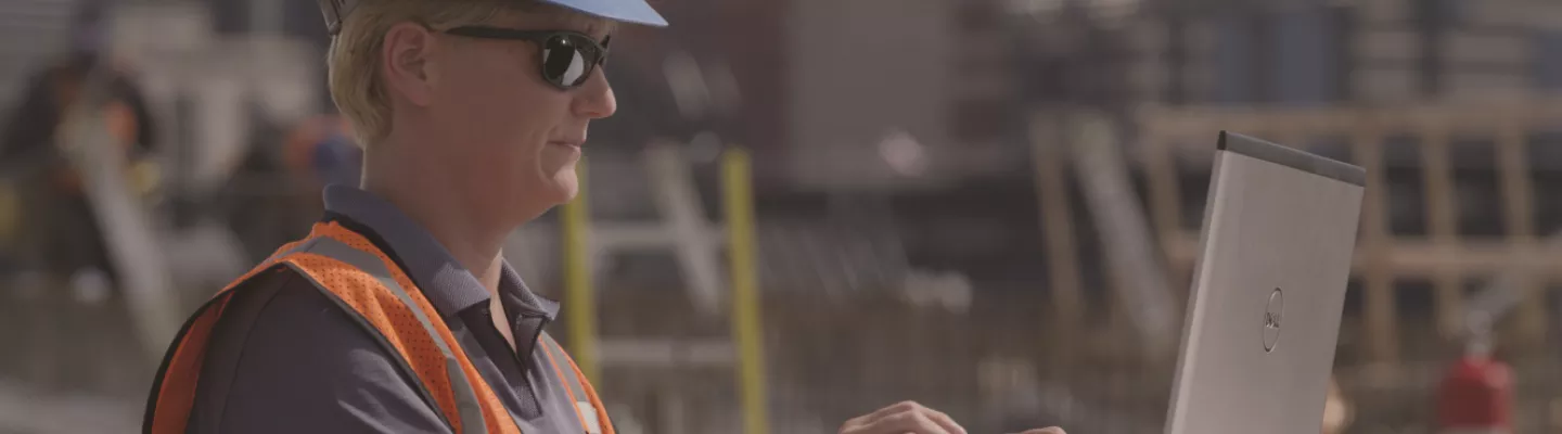 woman on jobsite with laptop