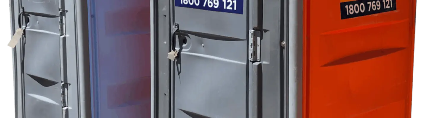 Portable toilet placed at a construction site, providing sanitation and comfort for on-site workers.