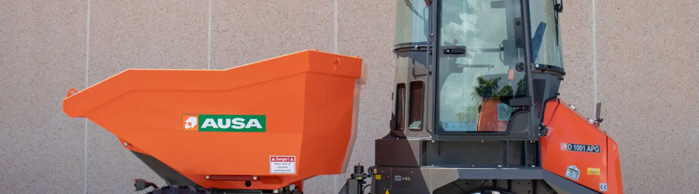AUSA site dumpers parked on a construction site, showcasing efficient material transport for site safety and productivity.
