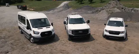 A commercial van, a commercial truck and an SUV