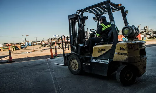 Worker on forklift