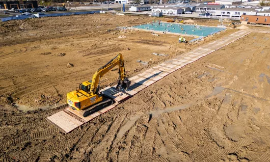 Installing mats on a jobsite